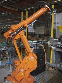 A robot on a production line for on-board units