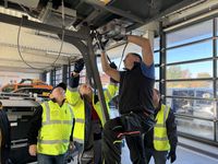 A roadside unit by Kapsch TrafficCom being installed on a German highway message sign