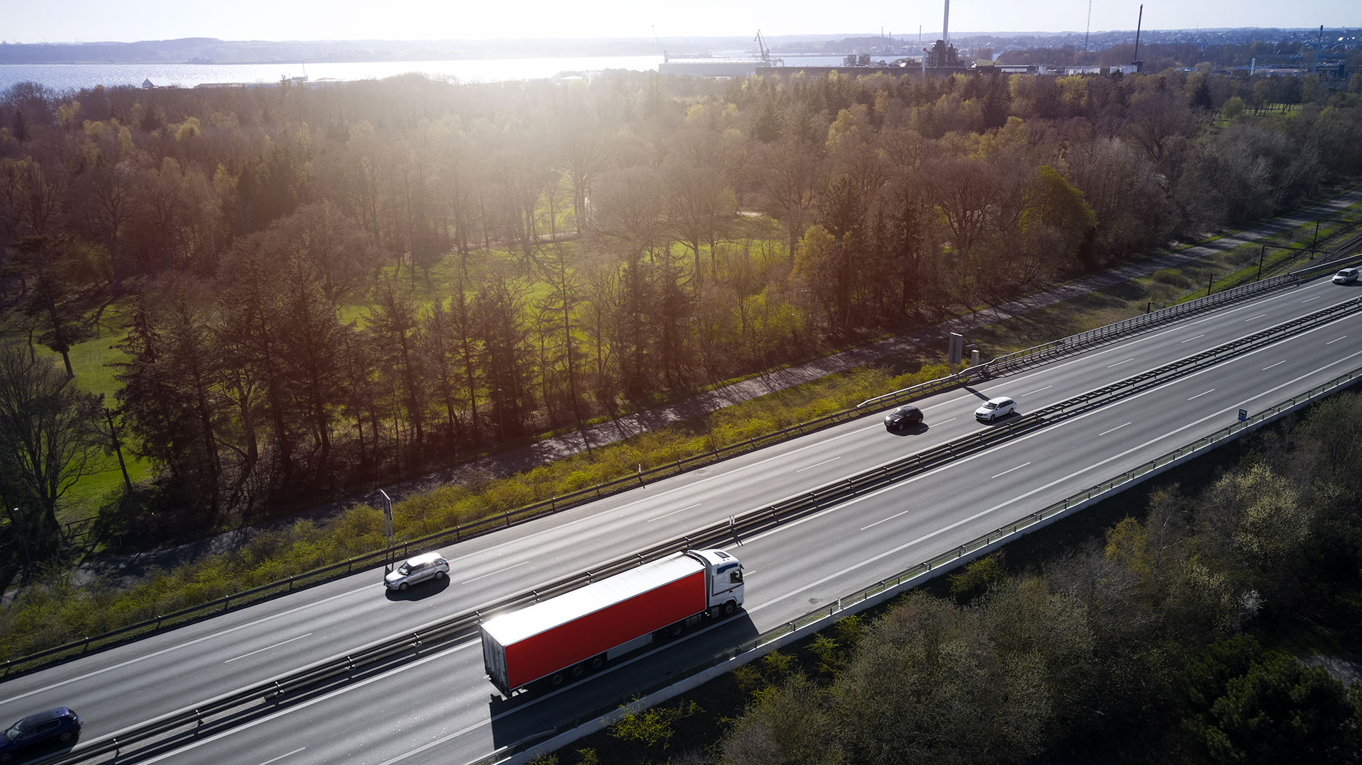 Truck with red trailer on highway, DK