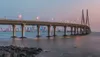 © Kapsch TrafficCom A bridge over water illuminated by lights, highlighting Kapsch TrafficCom's infrastructure solutions for traffic management and mobility.