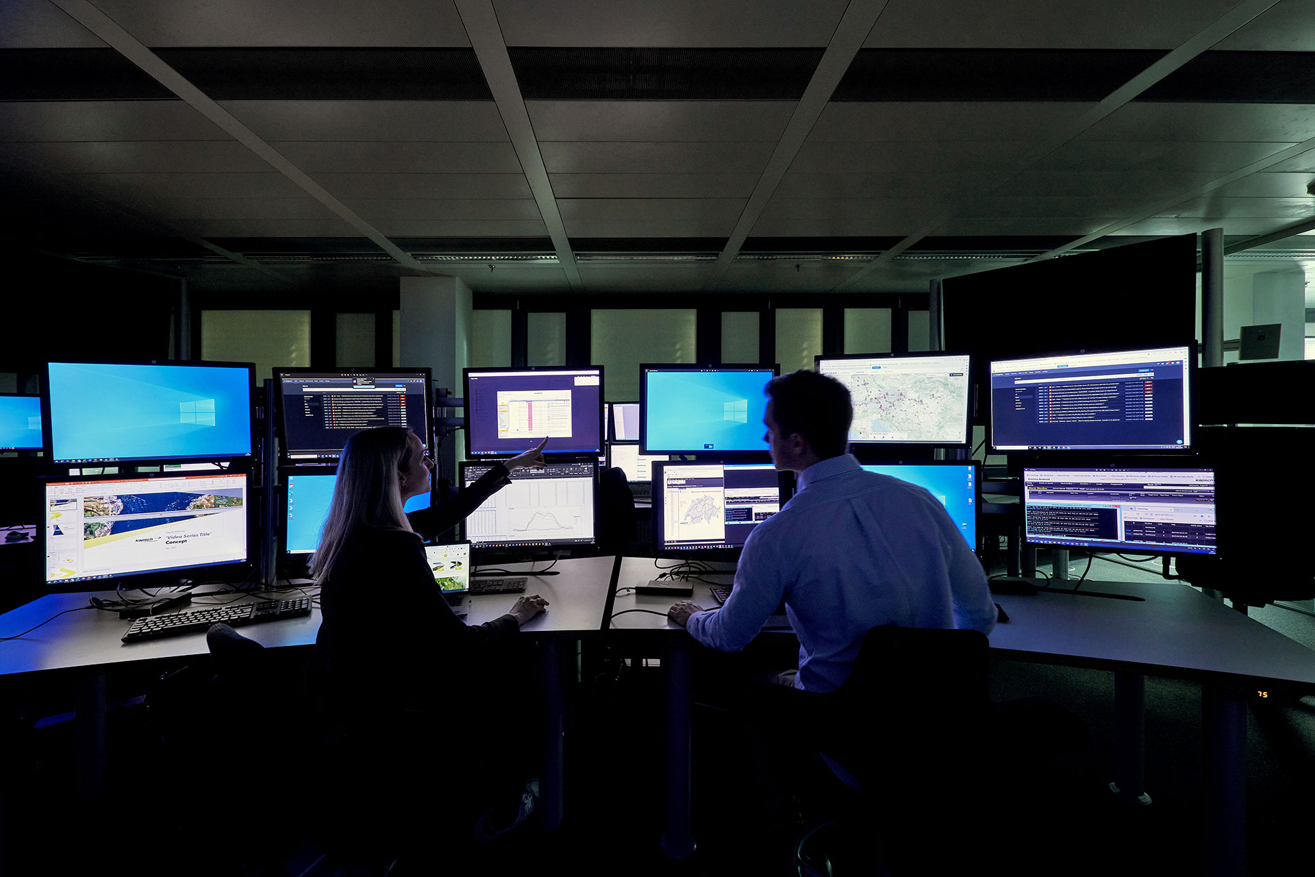 People monitoring screens