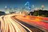 © Kapsch TrafficCom City skyline with a freeway showcasing Kapsch TrafficCom's urban infrastructure solutions.