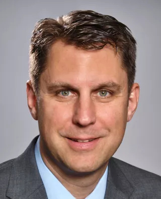 A man in a suit and tie.