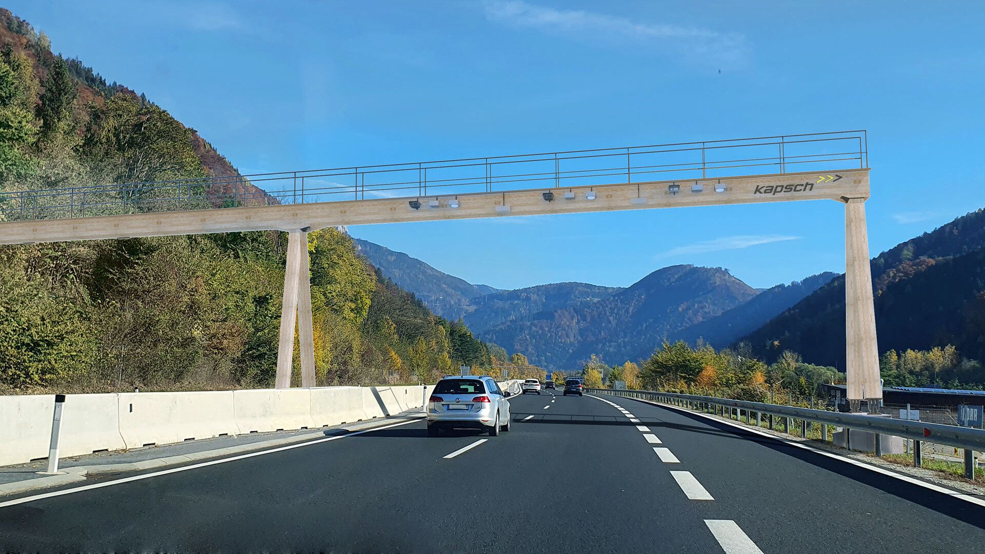 Autos auf einer Straße mit einer Brücke darüber