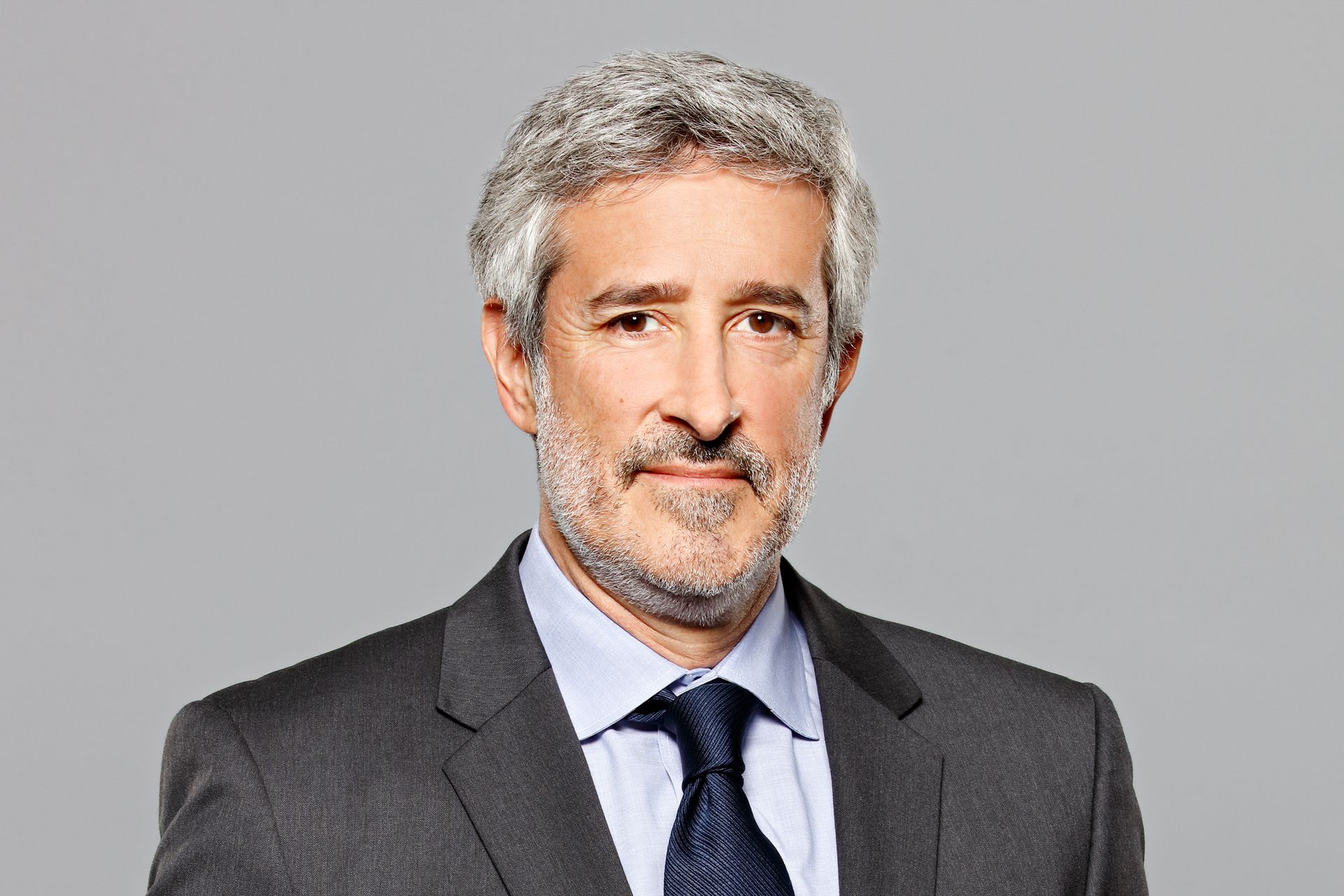 © Kapsch TrafficCom Georg Kapsch, CEO, in a suit and tie, portrait.
